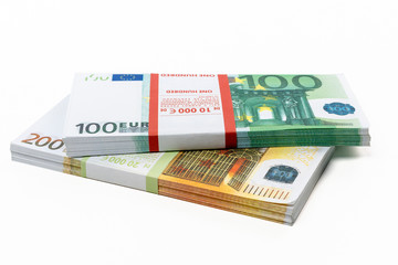 Euro cash in bundles of one hundred and two hundred banknotes, Euro money Euro on a white background, isolated on a white background