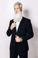Handsome aged man wearing stylish black suit