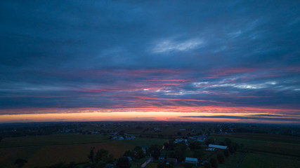 An Aerial View of a Sunset with Red and Blues on a Summer Night