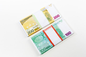 Euro cash in bundles of one hundred and two hundred banknotes, Euro money Euro on a white background, isolated on a white background