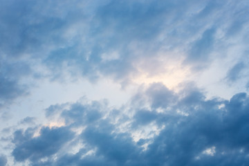 Obraz premium dramatic dark blue clouds in the backlight, morning