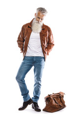 Handsome bearded senior man with leather bag and jacket on white background