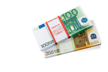 Obraz na płótnie Canvas Euro cash in bundles of one hundred and two hundred banknotes, Euro money Euro on a white background, isolated on a white background