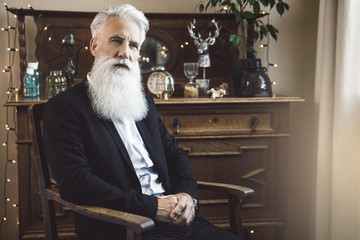 Handsome bearded senior man posing in studio