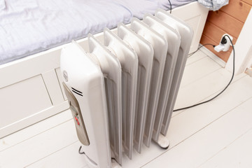 Oil-filled electrical mobile radiator heater for home heating and comfort control in the room