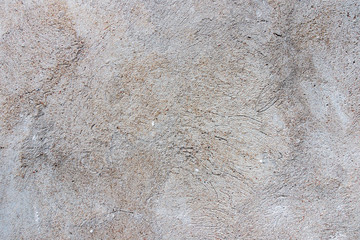 Dark plaster wall with dirty cracked scratched background. Old retro vintage brickwall with peel grey stucco texture