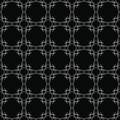 Fototapeta premium Seamless oriental pattern with Arabic ornaments. White lines on a black background.
