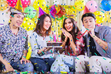 Young people congratulating birthday for their friend