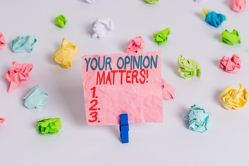 Conceptual hand writing showing Your Opinion Matters. Concept meaning show you do not agree with something that just been said Colored crumpled paper empty reminder white floor clothespin