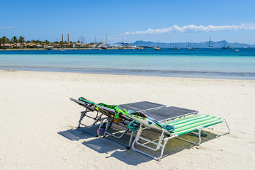 Sunbeds at the Playa de Alcudia beach in Mallorca, Spain