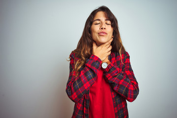 Young beautiful woman wearing red t-shirt and jacket standing over white isolated background shouting and suffocate because painful strangle. Health problem. Asphyxiate and suicide concept.