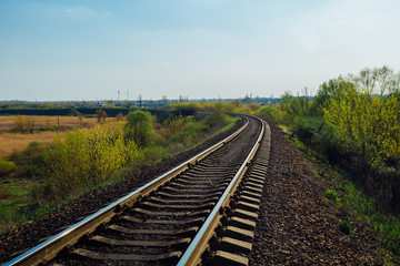 Fototapeta na wymiar Empty railway track in sunny summer day