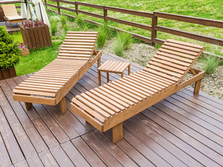 Wooden sunbeds for relaxing in the park at Rosa Khutor