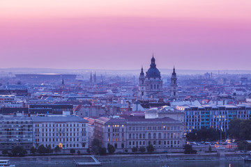 Fototapeta na wymiar Panoramic cityscape of Saint Stephen basilica on the Danube river. Colorful sunrise in Budapest, Hungary