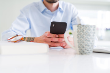 Close up of business man working using smartphone