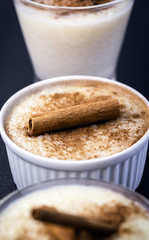 jars of rice pudding with cinnamon. Typical porridge from Brazil made with rice, condensed milk and coconut. Brazilian food typical of rural parties of June and July. Gastronomic tourism concept.