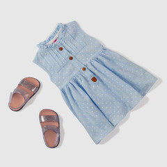 Toddler girl summer dress and sandals. Flat lay view.