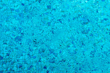 Swimming pool blue mosaic rock bottom. Texture.