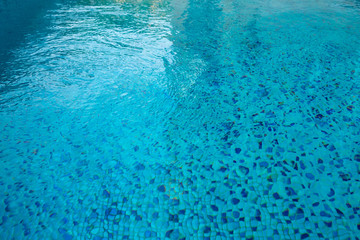 Fototapeta na wymiar Swimming pool blue mosaic rock bottom. Texture.