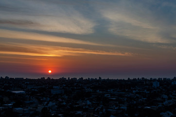 Sunrise over the sea. Red sun. Colorful clouds