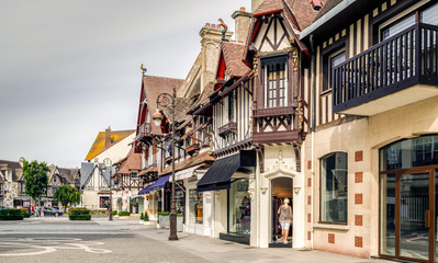 Traditional half-timbered houses on the streets of Deauville, Normandy, France. - obrazy, fototapety, plakaty