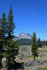 South Sister volcano framed by fir trees from Sparks Lake near Sisters, Oregon.