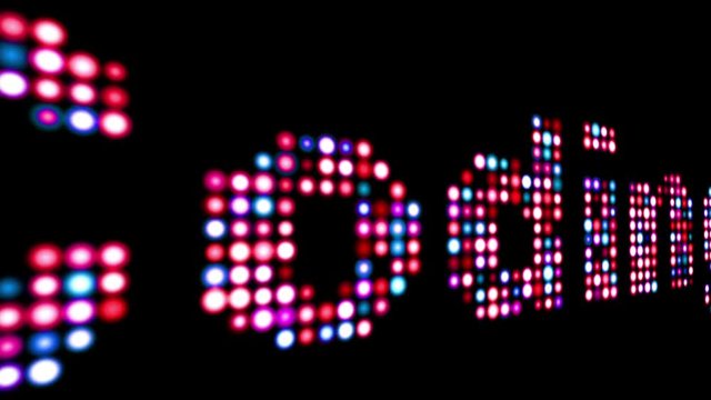 Coding colorful led text over black