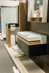 Picture of ceramic wash basin with chrome tap in bathroom fitment store