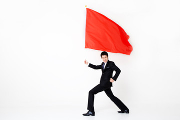 businessman waving a big flag.