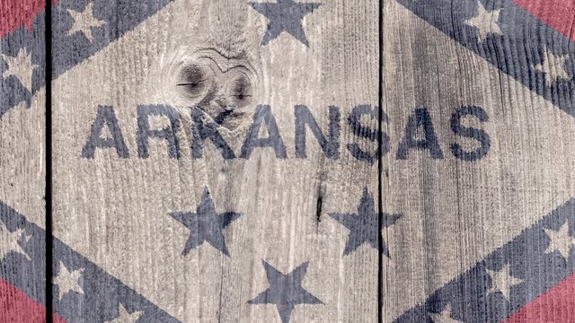 USA Politics News Concept: US State Arkansas Flag Wooden Fence, Zoom Out