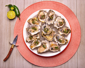 Fresh shucked oysters with jalapeno & lemon mignonette