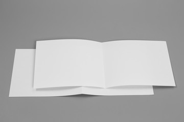 Blank portrait mock-up paper. brochure magazine isolated on gray, changeable background / white paper isolated on gray
