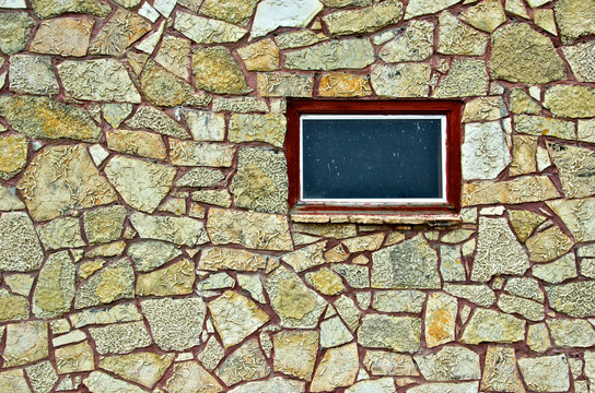 Rock wall and window, highway 95, Nortern Nevada. Material used show mudcracks from bygone era