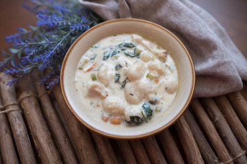 Traditional Italian chicken gnocchi soup in a bowl