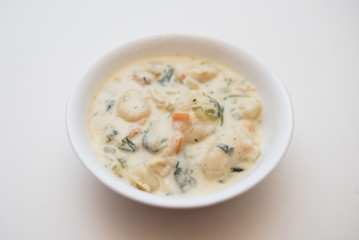 Traditional Italian chicken gnocchi soup in a bowl