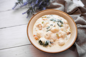 Traditional Italian chicken gnocchi soup in a bowl