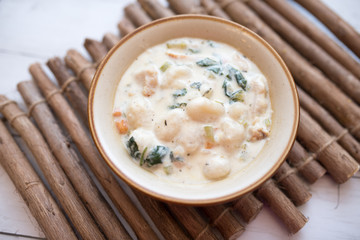 Traditional Italian chicken gnocchi soup in a bowl