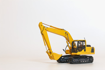 Excavator model on a white background with copy space