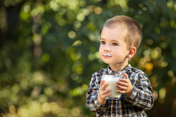 little boy drinking yogurt