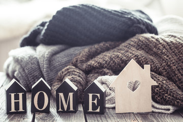 cozy still life with sweaters and letters home