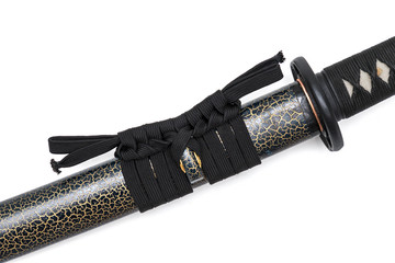Black sageo cord for tie the textured scabbard of Japanese sword and steel fitting isolated in white background.