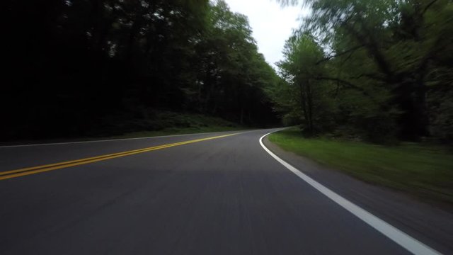 Faint Headlights on Road at Low Angle