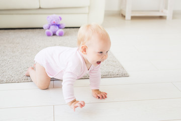 beautiful smiling baby crawling for the first time.