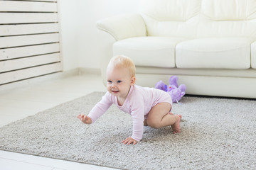 beautiful smiling baby crawling for the first time.