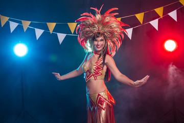 Holidays, party, dance and nightlife concept - Beautiful woman dressed for carnival night