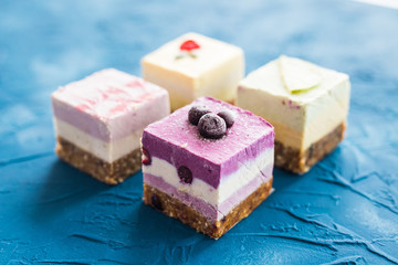 Homemade raw cakes with fresh berries and nuts. healthy vegan food concept, close up