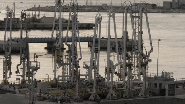 Gas loading arms on pier in the port.mov
