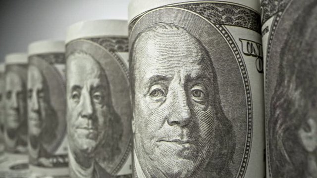 American one hundred dollar paper banknote in close up macro view dolly shot. Concept of finance and economy.