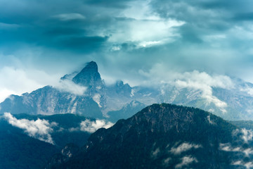 Fototapeta na wymiar Watzmann peak in Germany Alps. dark scene with fog