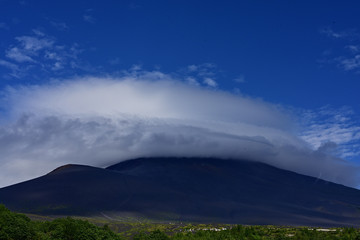 There were white clouds sailing in the sky.